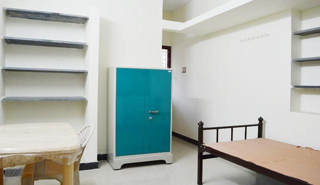 Accommodation — cot, table & wardrobe — TNG Senior Citizens Home, Coimbatore
